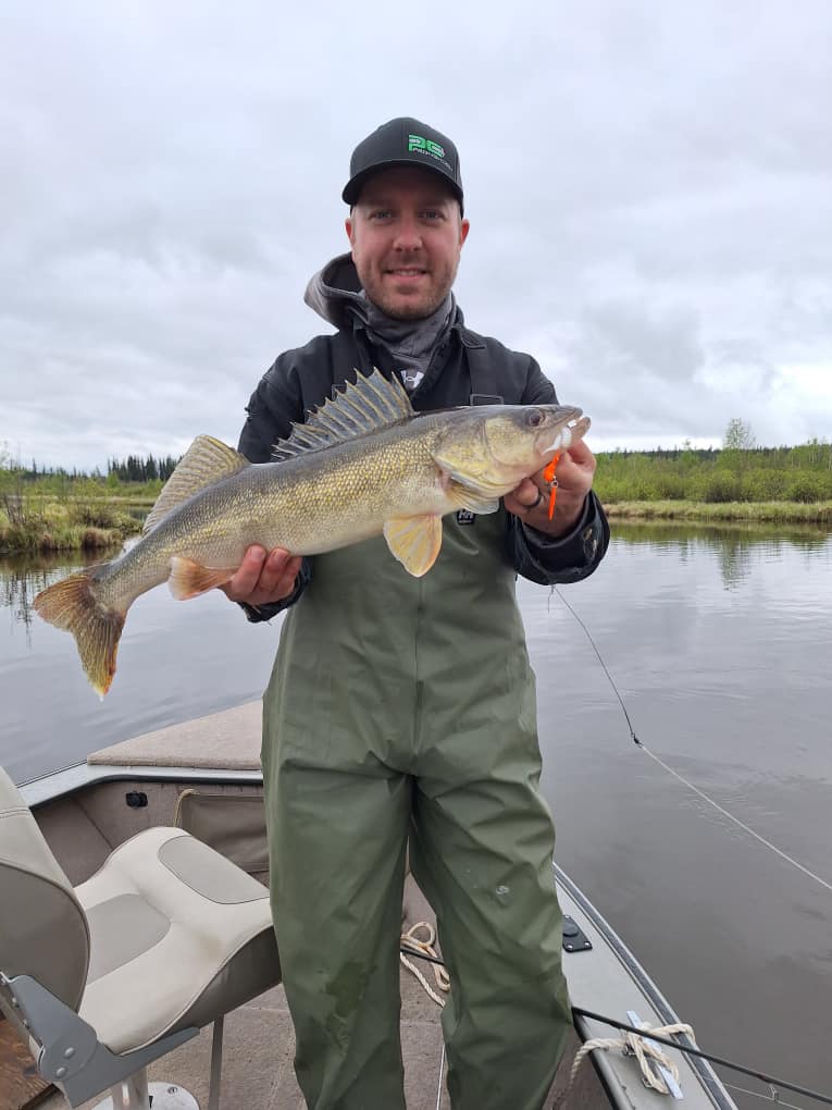 A person fly fishing in a river